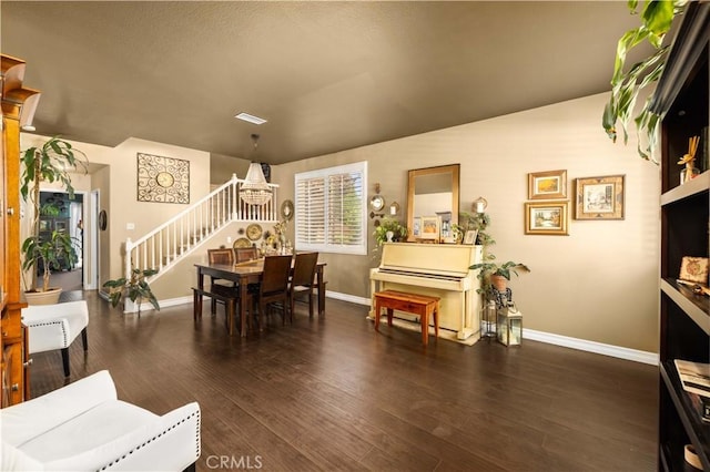 45749 21st St W, Lancaster, CA 93536 - dining room with stairs, wood finished floors, and a chandelier