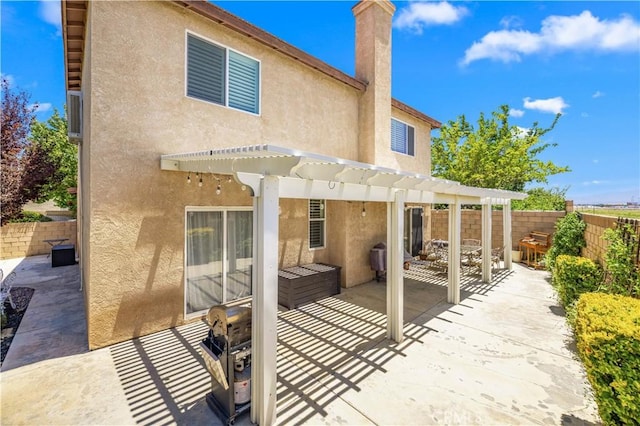 45749 21st St W, Lancaster, CA 93536 - back of property featuring stucco siding, a pergola, and a patio