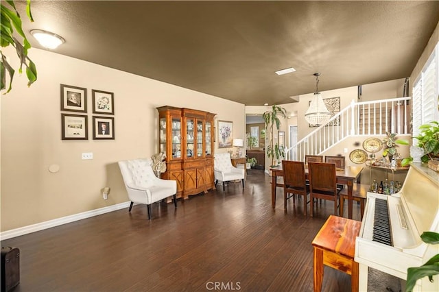 45749 21st St W, Lancaster, CA 93536 - dining area featuring stairs, wood-type flooring, and a chandelier
