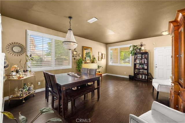 45749 21st St W, Lancaster, CA 93536 - dining space featuring a chandelier and dark wood-style flooring