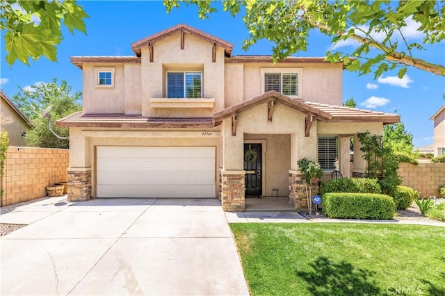 45749 21st St W, Lancaster, CA 93536 - view of front of property with a garage, driveway, stucco siding, and a tiled roof