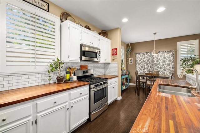 45749 21st St W, Lancaster, CA 93536 - kitchen featuring wooden counters, stainless steel appliances, backsplash, and recessed lighting