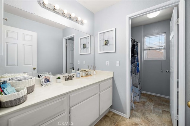 45749 21st St W, Lancaster, CA 93536 - full bath with vanity and stone finish flooring