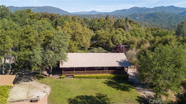 42179 High Point Ct, Ahwahnee, CA 93601 - aerial view of property and surrounding area featuring a heavily wooded area and a mountainous background