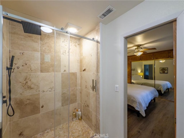 42179 High Point Ct, Ahwahnee, CA 93601 - bathroom featuring ensuite bathroom, a stall shower, wood finished floors, and a ceiling fan