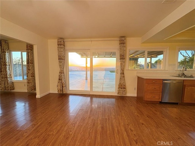 22407 Birds Eye Dr, Diamond Bar, CA 91765 - kitchen with dishwasher, light countertops, dark wood-style flooring, and brown cabinetry