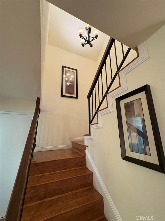 22407 Birds Eye Dr, Diamond Bar, CA 91765 - staircase featuring wood finished floors and a chandelier