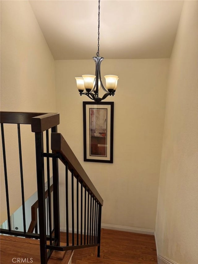 22407 Birds Eye Dr, Diamond Bar, CA 91765 - stairway with a chandelier and wood finished floors