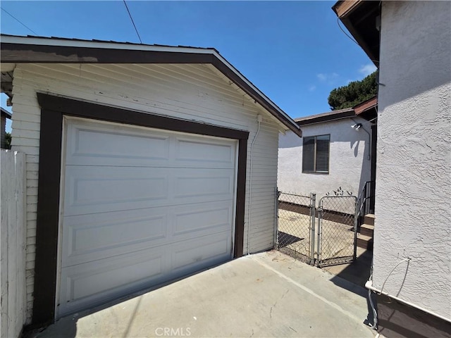 521 E 7th St, National City, CA 91950 - garage featuring a gate and driveway