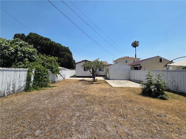 521 E 7th St, National City, CA 91950 - fenced backyard featuring a patio area