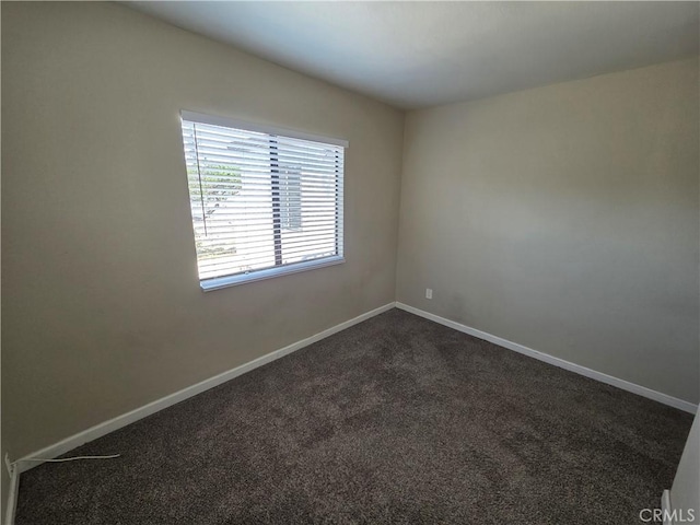 521 E 7th St, National City, CA 91950 - unfurnished room featuring dark colored carpet and baseboards