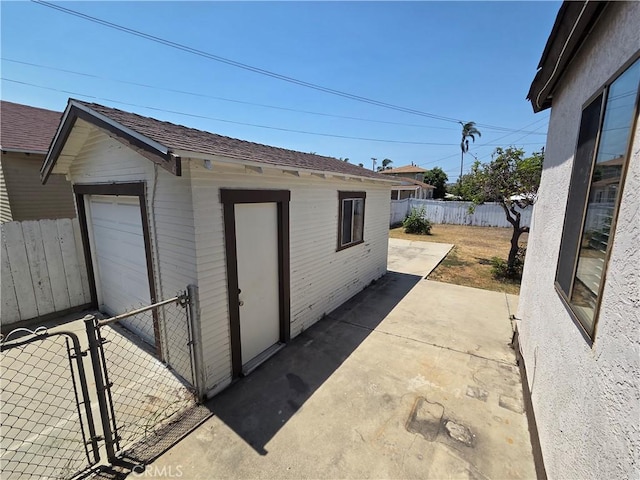 521 E 7th St, National City, CA 91950 - view of outbuilding with a fenced backyard