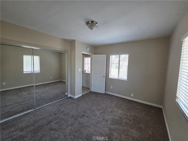 521 E 7th St, National City, CA 91950 - unfurnished bedroom featuring carpet floors, multiple windows, and a closet