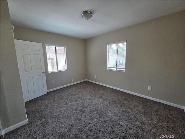 521 E 7th St, National City, CA 91950 - unfurnished room featuring plenty of natural light and dark colored carpet