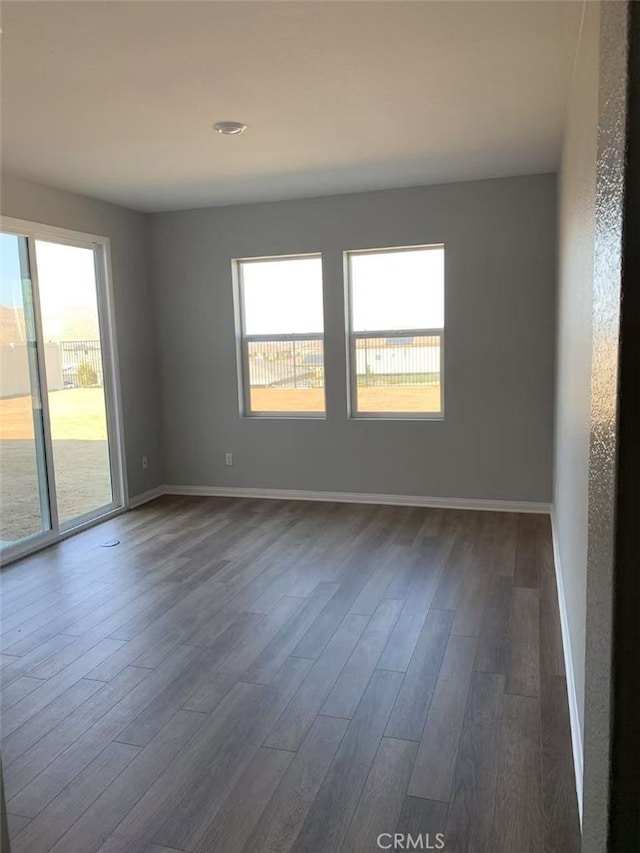 7453 Grazing Ln, Riverside, CA 92507 - spare room featuring dark wood-type flooring and baseboards