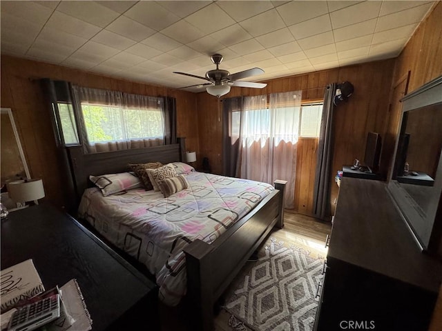 23789 Zuger, Crestline, CA 92325 - bedroom with wooden walls, light wood-style floors, and ceiling fan