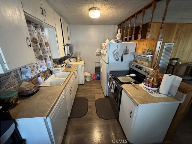23789 Zuger, Crestline, CA 92325 - kitchen featuring appliances with stainless steel finishes, white cabinetry, and wood walls