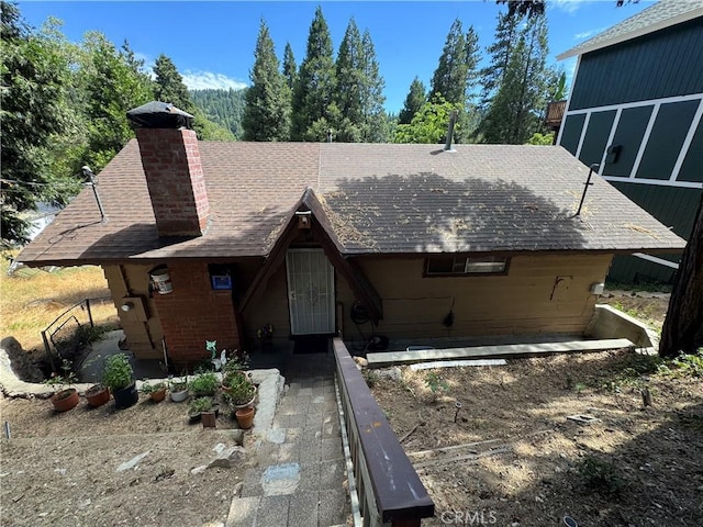 23789 Zuger, Crestline, CA 92325 - view of front of property featuring a chimney and a shingled roof
