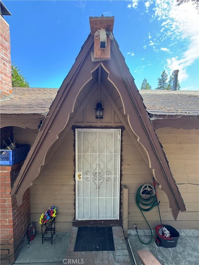 23789 Zuger, Crestline, CA 92325 - view of exterior entry with a shingled roof