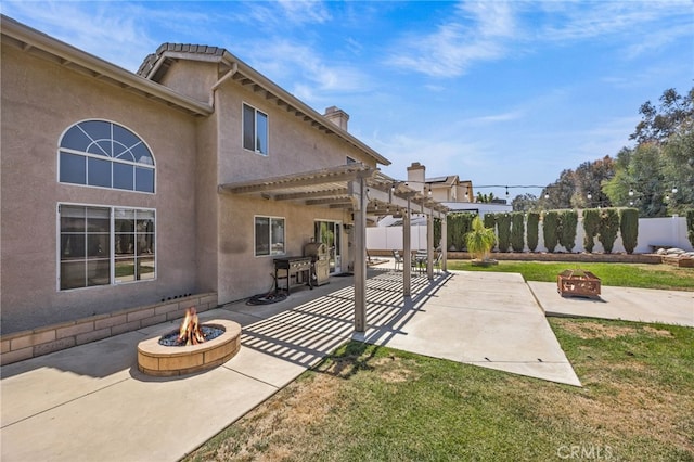 13106 Thicket Pl, Corona, CA 92883 - fenced backyard featuring a fire pit, a patio, and a pergola