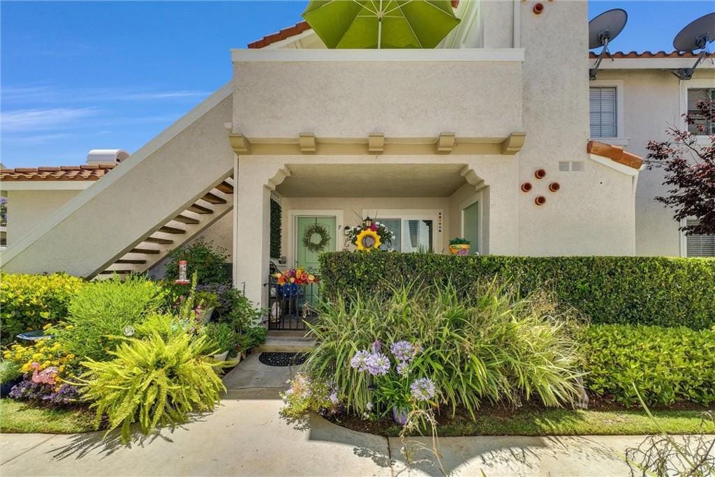 9 Pica Flor Unit 63, Rancho Santa Margarita, CA 92688 - entrance to property with stucco siding