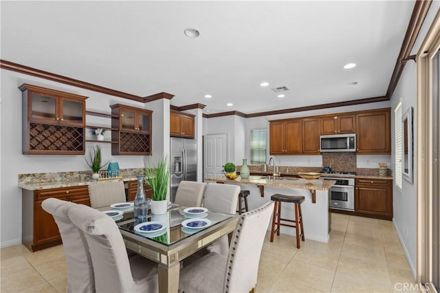 41 Keepsake, Irvine, CA 92618 - dining room featuring light tile patterned floors, crown molding, and recessed lighting