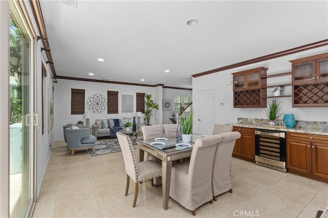 41 Keepsake, Irvine, CA 92618 - dining area featuring beverage cooler, ornamental molding, light tile patterned flooring, plenty of natural light, and recessed lighting