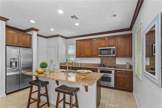 41 Keepsake, Irvine, CA 92618 - kitchen featuring stainless steel appliances, decorative backsplash, light tile patterned flooring, ornamental molding, and light stone countertops