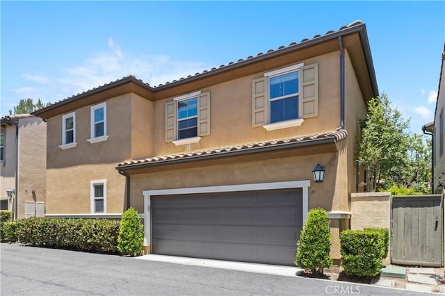 41 Keepsake, Irvine, CA 92618 - mediterranean / spanish home with an attached garage, stucco siding, and a tile roof