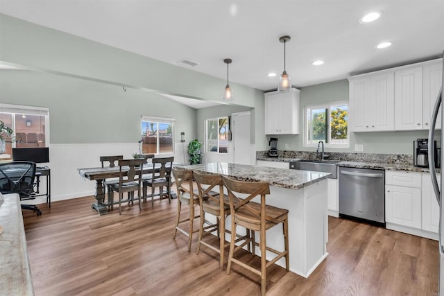 552 Emory St, Imperial Beach, CA 91932 - kitchen with dishwasher, white cabinets, recessed lighting, light stone countertops, and light wood finished floors