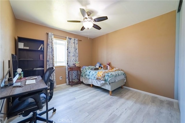 24561 Sinaloa St, Moreno Valley, CA 92557 - bedroom with light wood-type flooring, a desk, and ceiling fan