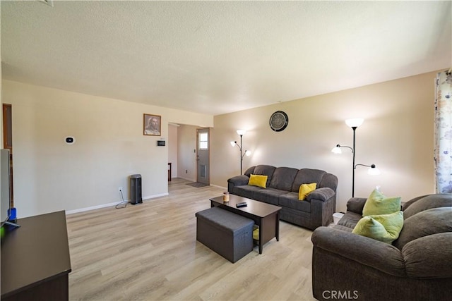 24561 Sinaloa St, Moreno Valley, CA 92557 - living area with light wood-type flooring and a textured ceiling