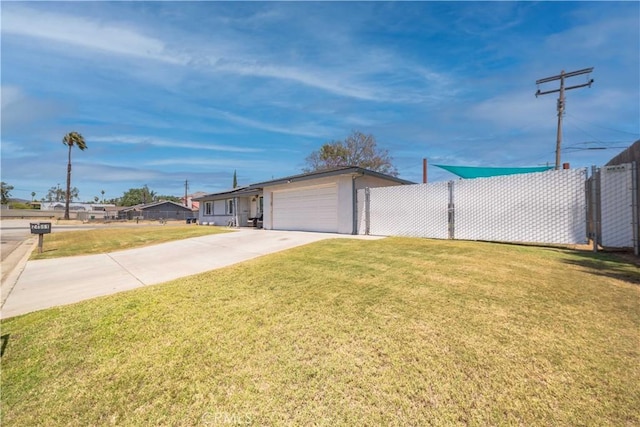 24561 Sinaloa St, Moreno Valley, CA 92557 - view of yard with an attached garage and concrete driveway