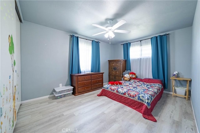 24561 Sinaloa St, Moreno Valley, CA 92557 - bedroom with light wood finished floors, multiple windows, and ceiling fan