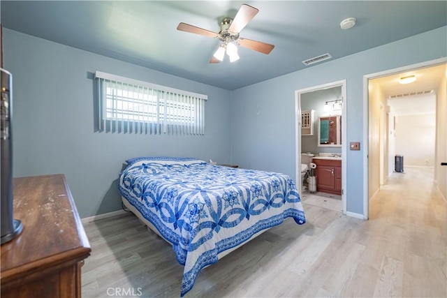 24561 Sinaloa St, Moreno Valley, CA 92557 - bedroom featuring light wood-type flooring, connected bathroom, and ceiling fan