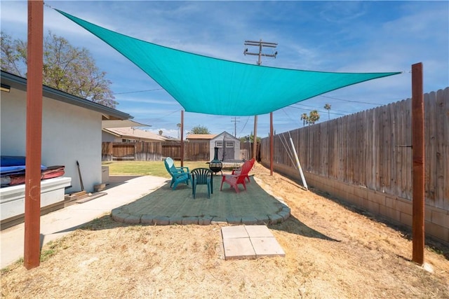24561 Sinaloa St, Moreno Valley, CA 92557 - fenced backyard with a storage unit and a patio