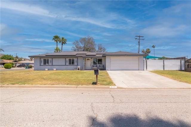 24561 Sinaloa St, Moreno Valley, CA 92557 - ranch-style home featuring a garage, concrete driveway, solar panels, and stucco siding