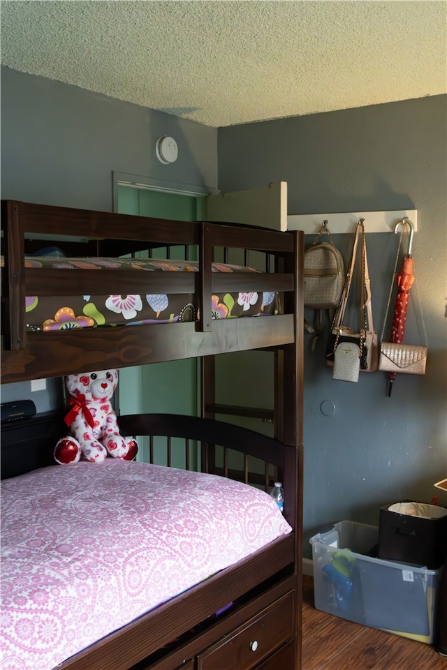 895 Garner Ave, San Bernardino, CA 92411 - bedroom featuring a textured ceiling and wood finished floors