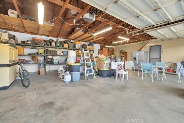 36227 Montezuma Valley Rd, Ranchita, CA 92066 - garage with stainless steel fridge with ice dispenser and a garage door opener