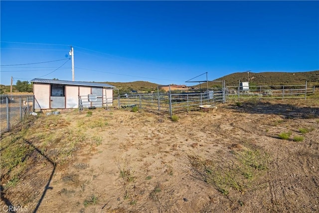 36227 Montezuma Valley Rd, Ranchita, CA 92066 - view of yard with an outbuilding, an exterior structure, a mountain view, and a view of rural / pastoral area