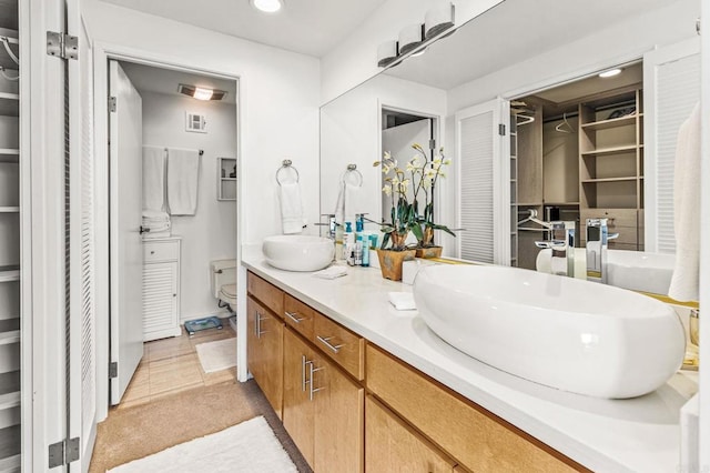 2500 Torrey Pines Rd Unit 805, La Jolla, CA 92037 - bathroom featuring double vanity, recessed lighting, and a spacious closet