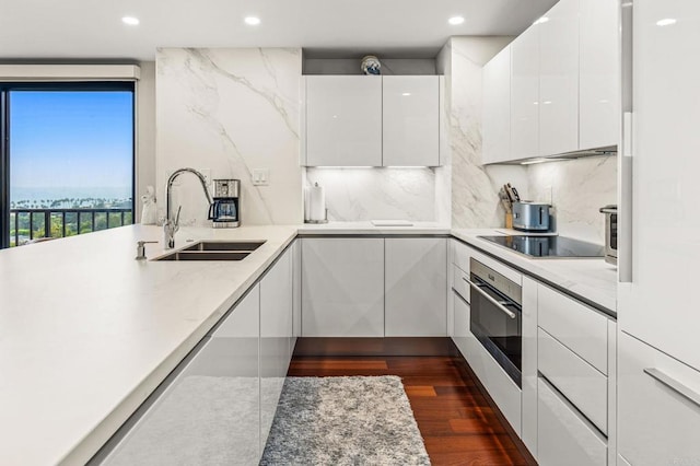 2500 Torrey Pines Rd Unit 805, La Jolla, CA 92037 - kitchen with stainless steel oven, modern cabinets, white cabinetry, black electric stovetop, and recessed lighting