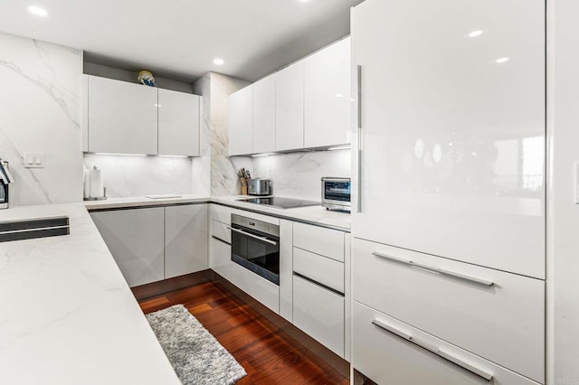 2500 Torrey Pines Rd Unit 805, La Jolla, CA 92037 - kitchen with oven, white cabinetry, black electric stovetop, modern cabinets, and recessed lighting