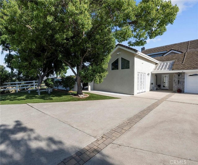 40620 Via Ranchitos, Fallbrook, CA 92028 - view of front of home with french doors, concrete driveway, and stucco siding