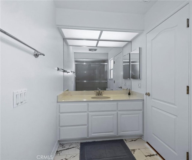 40620 Via Ranchitos, Fallbrook, CA 92028 - bathroom with marble look tile flooring, vanity, and a shower with door