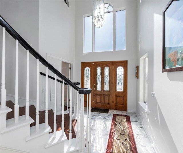 40620 Via Ranchitos, Fallbrook, CA 92028 - entryway featuring marble tiled floors, stairway, healthy amount of natural light, and a high ceiling