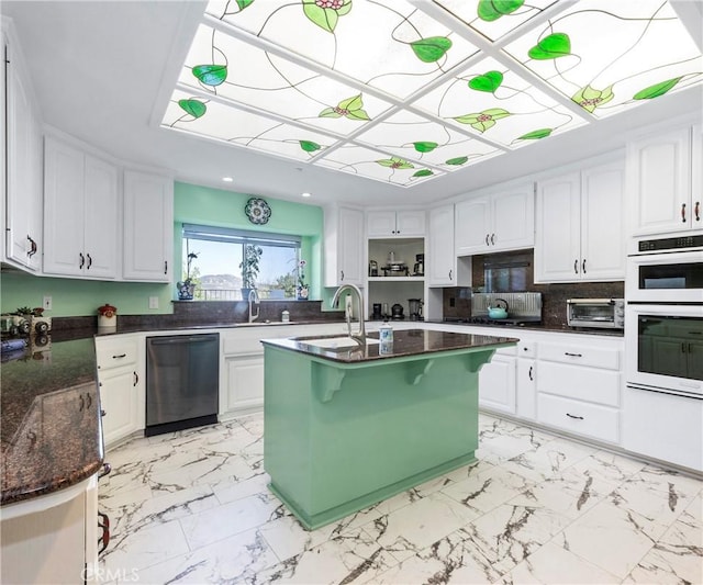 40620 Via Ranchitos, Fallbrook, CA 92028 - kitchen with dishwasher, double oven, light marble finish floors, white cabinetry, and recessed lighting