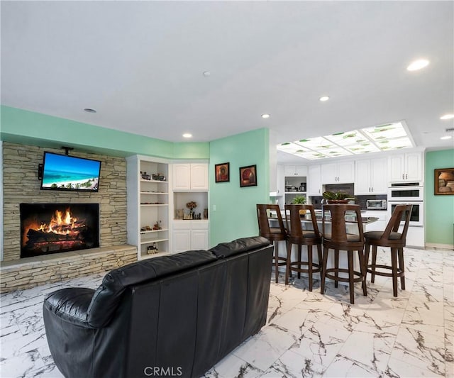 40620 Via Ranchitos, Fallbrook, CA 92028 - living area with a fireplace, light marble finish flooring, and recessed lighting