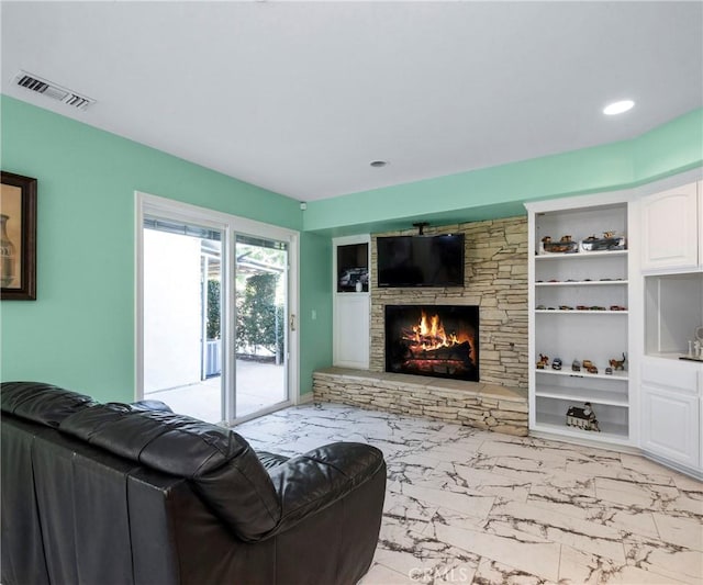 40620 Via Ranchitos, Fallbrook, CA 92028 - living area featuring marble finish floors, a stone fireplace, built in features, and recessed lighting