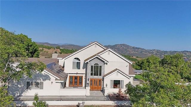 40620 Via Ranchitos, Fallbrook, CA 92028 - view of front facade with french doors, a fenced backyard, stucco siding, a mountain view, and a patio